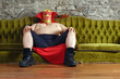 Photo: Mexican wrestler sitting on a couch Mexican wrestler sitting on a couch
