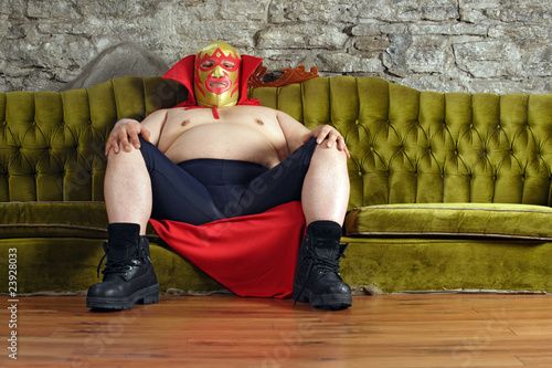 Photo: Mexican wrestler sitting on a couch Mexican wrestler sitting on a couch