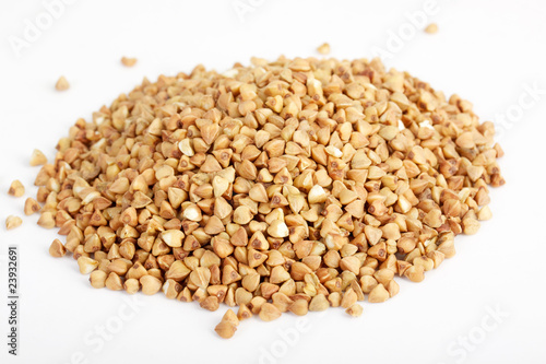 Photo: Buckwheat seeds closeup isolated on white Buckwheat seeds closeup isolated on white