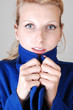 Pretty lady in blue coat.