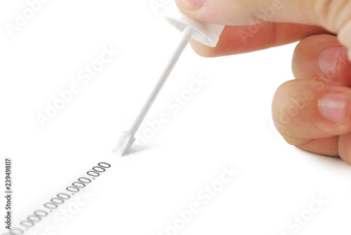 Photo: Erasing zeros with correction fluid on white background. Erasing zeros with correction fluid on white background.