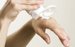Young Woman applying moisturizer. Young Woman applying moisturizer.