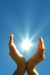hand sun and blue sky