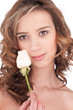 Close-up of beautiful girl with white rose flower
