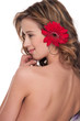 Close-up of beautiful girl with red aster flower