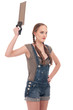 Young playful woman holding hand saw
