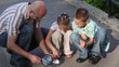 man, boy and girl burning paper by loupe