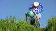 boy in american flag hat sits and holds globe