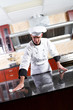 chef cleaning kitchen counter