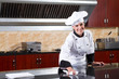 female chef cleaning kitchen