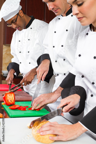 Photo: chefs cooking in industrial kitchen chefs cooking in industrial kitchen