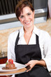 happy waitress holding dessert
