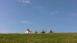 four musicians plays violins walks from behind hill four musicians plays violins walks from behind hill