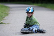 Preschooler falls over while rollerblading in the park