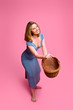 Woman throwing wicker basket