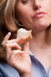 Woman eating sandwich