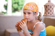 little girl sit on divan and eat. little girl sit on divan and eat.