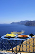 Gourmet Greek food and white wine with view of the Aegean Sea Gourmet Greek food and white wine with view of the Aegean Sea