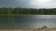 Over a pond the cloud, spring day floats