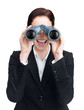 Happy young female executive looking through binoculars
