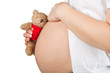 pregnant belly over white