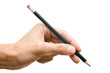 Pencil in a hand on a white background