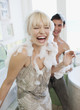 Couple covered with soap suds in bathroom