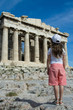 Child in front of Ancient Parthenon in Acropolis Athens Greece.