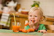little girl with carrot juice