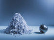 Metal globe next to pile of shredded paper