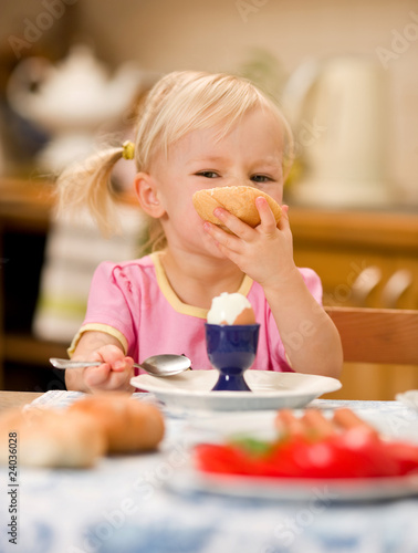 Photo: girl eating breakfast girl eating breakfast