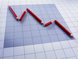 Red pencils forming declining graph