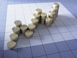 Stacks of pound coins forming ascending graph