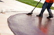 Road Worker Resurfacing Street
