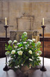 Church flower arrangement by the christening font