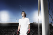 Soccer goalie standing by net
