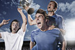 Soccer players cheering with trophy