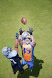 Football player catching football