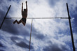 Pole vaulter in mid-air