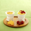 aniseed cream dessert with raspberries ,vanilla custard with orange puree