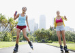 Friends rollerblading in park
