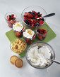 Foto: putting the fruit in the verrines and adding the faisselle putting the fruit in the verrines and adding the faisselle