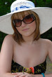 Pretty young woman wearing large hat Pretty young woman wearing large hat