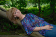 Pretty young woman lay on tree Pretty young woman lay on tree