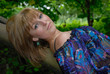 Beautiful young woman lay on tree Beautiful young woman lay on tree