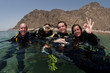 group of scuba divers on surface