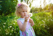 Little girl with dandelion.