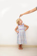 Mother measuring height of a child
