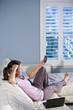 Woman relaxing and looking at text messages