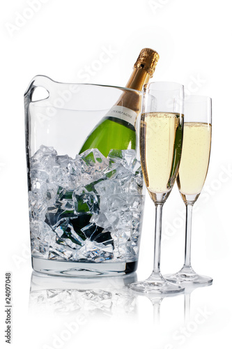 Photo: Champagne in a ice bucket and two champagne flutes Champagne in a ice bucket and two champagne flutes